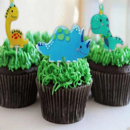 candele di dinosauro sui cupcakes