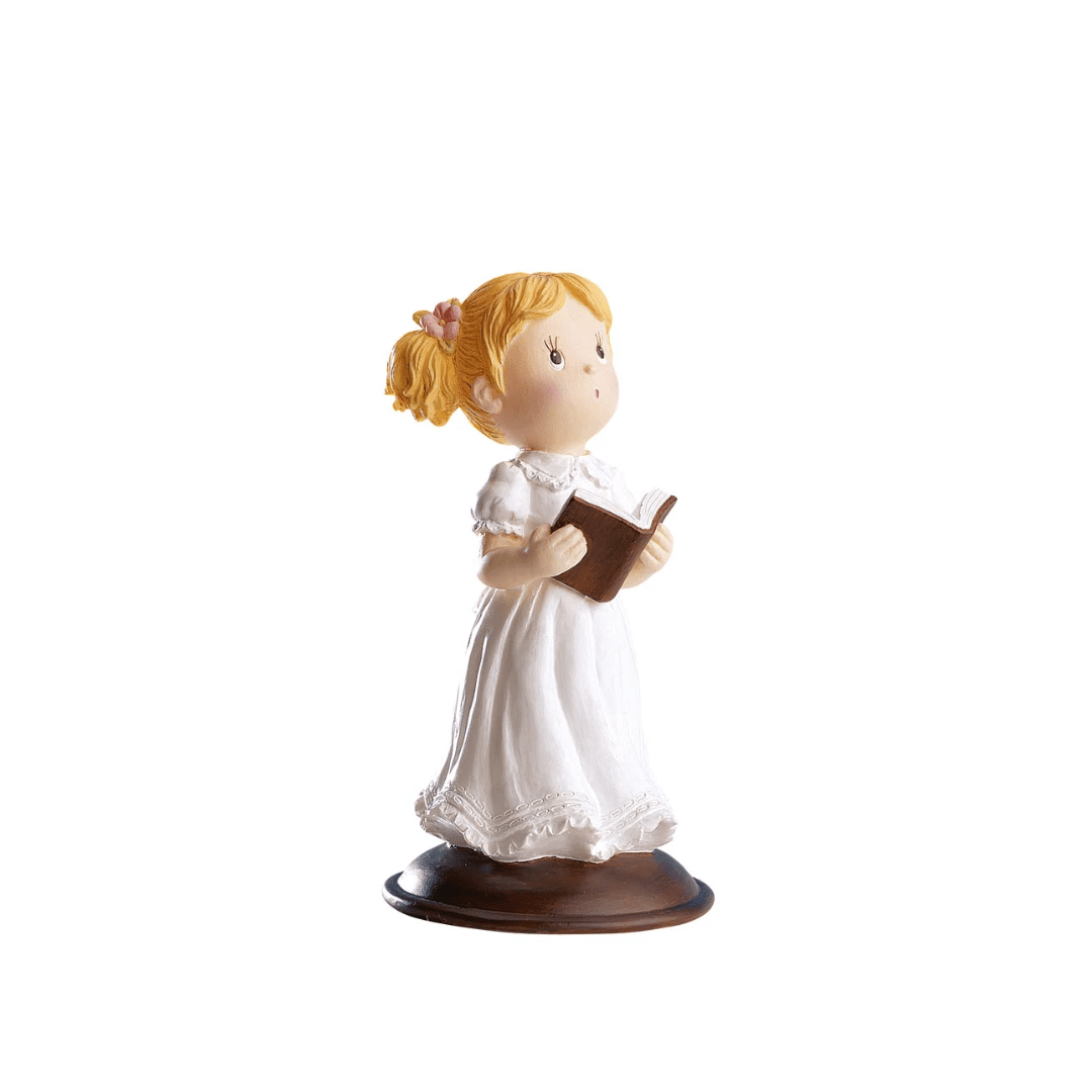 statuetta per la torta della prima comunione di una bambina, raffigurante una Bibbia che tiene in mano.