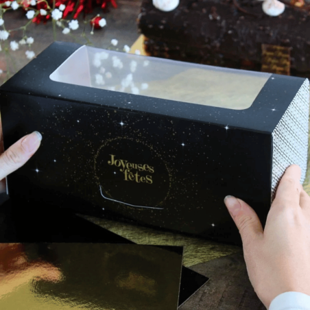 Tronchetto di Natale nero con decorazioni dorate, buone feste
